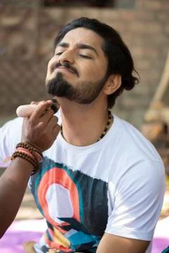An Indian young model is getting ready for the shoot. Indian make up and fash Stock Photos