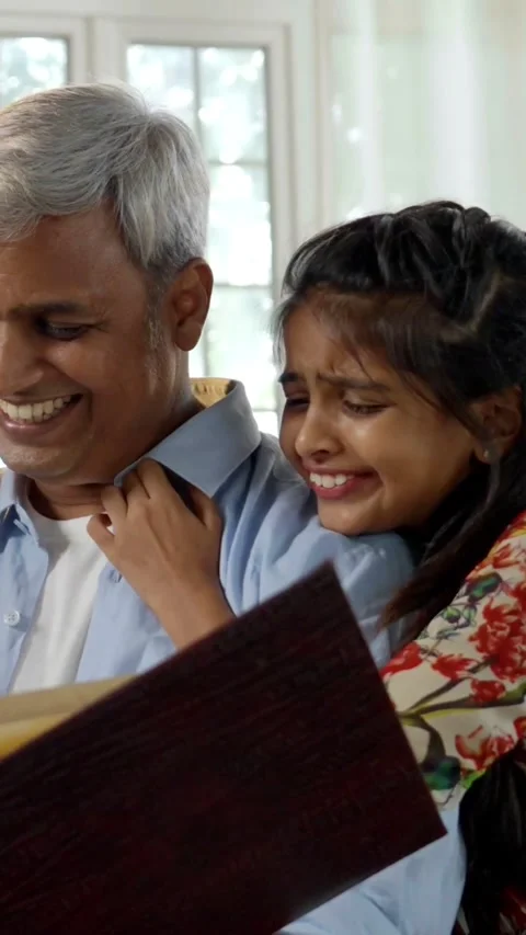 Indian young parents and two small kids spending quality time together indoors Video stock 343365028