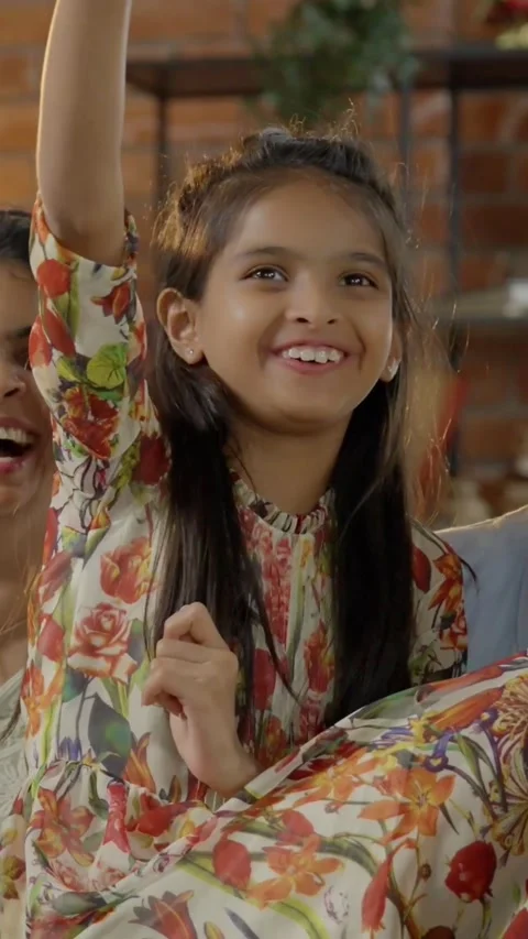 Indian young parents and two small kids spending quality time together indoors Stockbeeldmateriaal 343365119