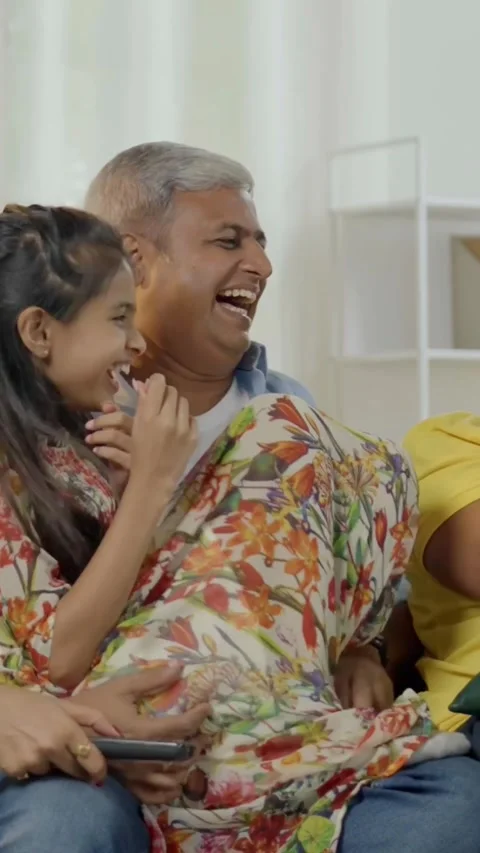 Indian young parents and two small kids spending quality time together indoors Stock-Footage 343365120