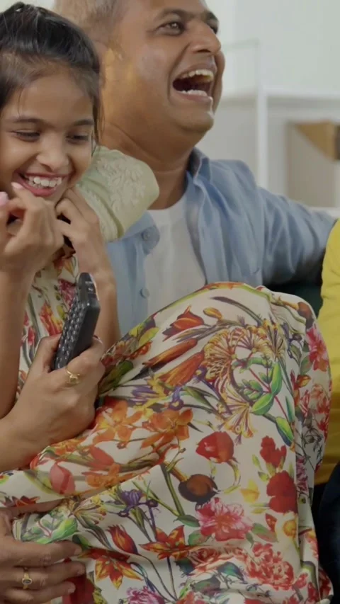 Indian young parents and two small kids spending quality time together indoors Stock Footage 343365122