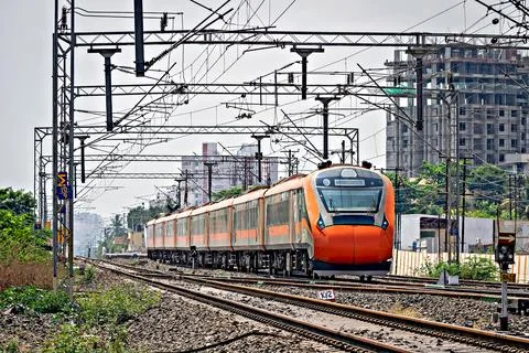 India's first indigenous development semi high speed orange Vande Bharat ex.. Stock Photos