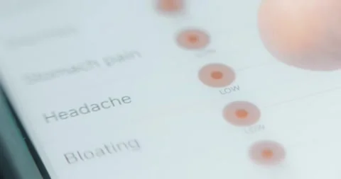 Indicating the level of severeness of headache on a scale in health tracker app Stock-Footage 314878912