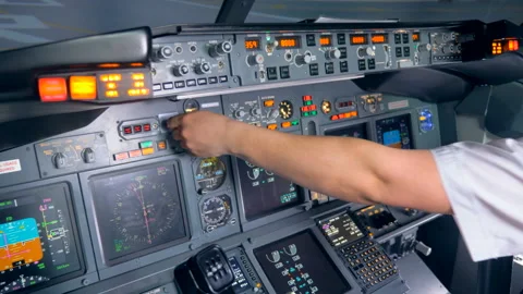 Indicators of an aircraft console are getting switched on and off by a pilot Video stock 93662135