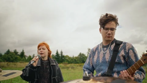 Indie Music Band Playing Instruments in Countryside Meadow Stock Footage 345473232