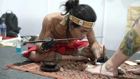 Indigenous Bali Tattoo Method Demonstrated at Cultural Event in India Video stock 331224815