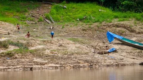 Indigenous children near river Stock Photos