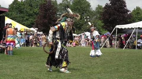 Indigenous dancers performing at pow wow during the day Stock Footage 246430775