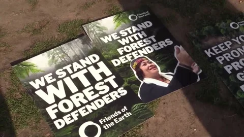 Indigenous leaders protest outside UK Parliament during London Climate Action We Stock Footage 337635354
