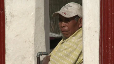 Indigenous man in baseball cap turns head Stock Footage 39454452