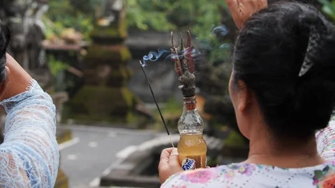 Indigenous people using smoke cleansing at Melukat Mebayuh Ceremonial, Bali Stock Footage 140297372