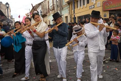 Indigenous quechua playing flute at Easter procession Stock Photos