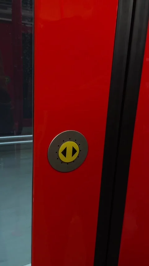 Individual activating yellow door close button on train control panel Stock Footage 335366558