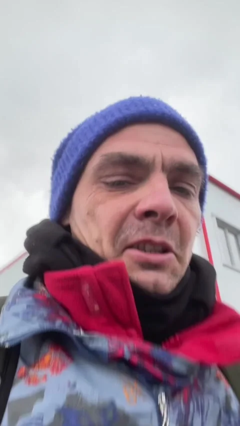 Individual captures street scene while discussing weather conditions Stock Footage 335435685