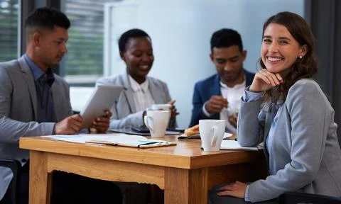 Individual commitment to a group effort. Shot of a group of colleagues having Foto stock