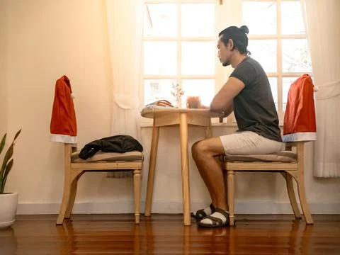 Individual contemplating illustrations in welllit creative studio Stock-Fotos
