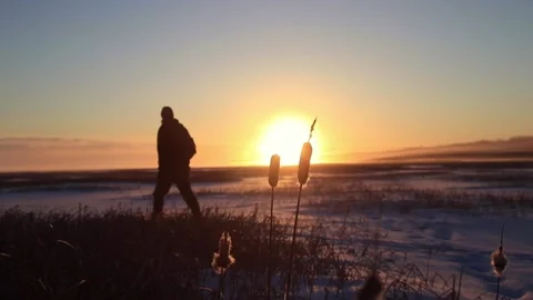 An Individual Hiking Through The Snow Stock Footage 218642767
