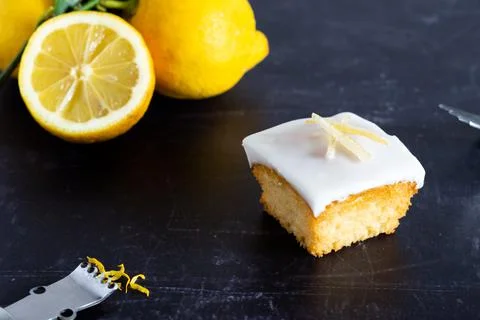 An individual lemon cake on a dark background Stock Photos