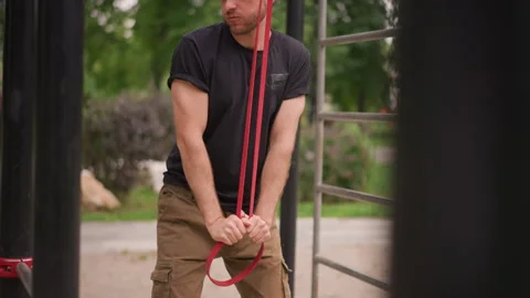 Individual Practicing Knot Tying At Outdoor Exercise Station, Man In Outdoor Stock Footage 330898894