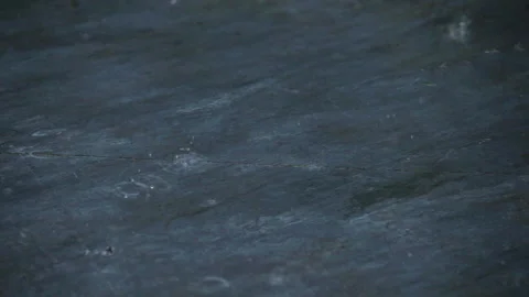 Individual rain drops on slate slab Stock Footage 221585375