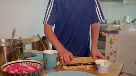 Individual skillfully rolling sushi for practice at home kitchen Stock Footage 320957407