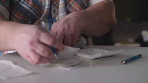 Individual Sorting Receipts And Documents Carefully, Man Systematically Stock Footage 327333897