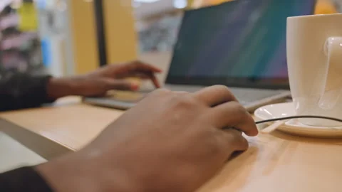 Individual studying and planning at coffee shop setup scene. Casual and focused Stock Footage 333184582