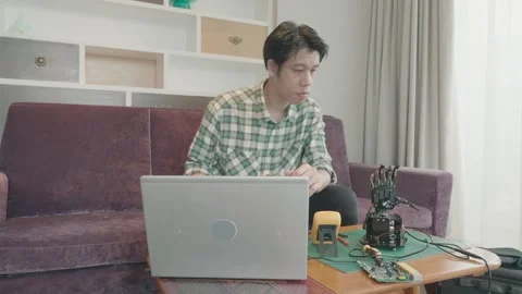 Individual Working with Technology in a Modern Home Setting Video stock 342281535