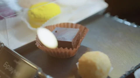 Individually arranged macarons and truffles in appealing setting. Assorted Stock Footage 338434991