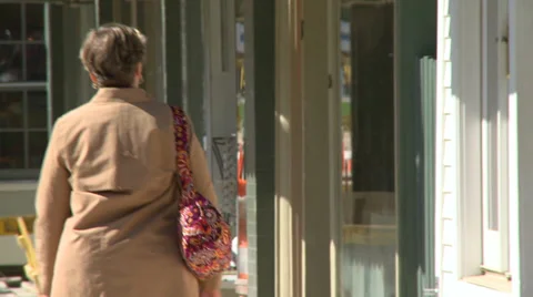 Individuals moving through town (7 of 7) Stock Footage 34281061