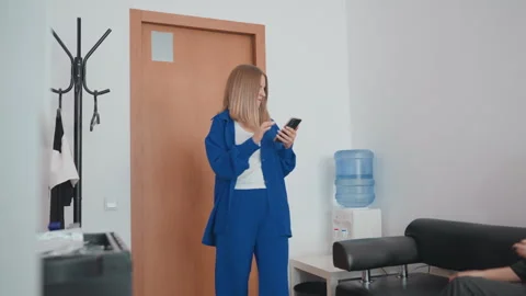 Individuals in office react amidst anxious atmosphere, Scene depicts office Stock Footage 329437385