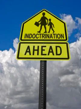 Indoctrination ahead warning roadsign Stock Photos