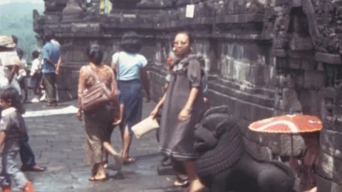 Indonesia - 1981: Tourists walk around a Buddhist temple Borobudur in Java Stock-Footage 285315853