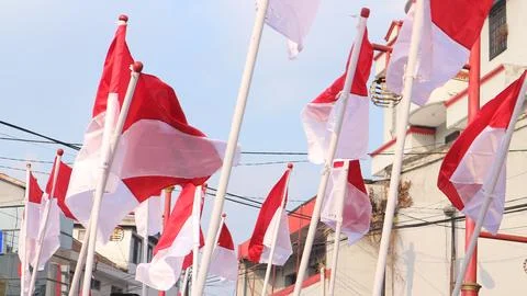 Indonesia flags under blue sky independence day concept Stock Photos