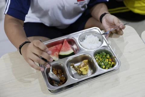 Indonesia government's nutritious meals program continues amid food poisoning, D Stock Photos