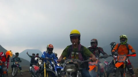 Indonesia, Java, May 16 2024 Motorcyclists in helmets and motorcycles Stock Footage 279985261