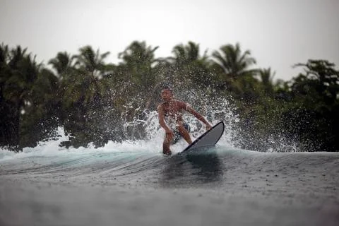 Indonesia, Java, surfer on a wave Photos