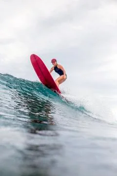 Indonesia, Java, woman surfing Stock Photos