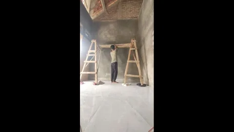 Indonesia: Man falls from makeshift scaffold while working in Banyumas, I... Vídeos de archivo 321413626