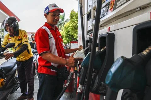 Indonesia rations subsidized fuel and implements work from home for civil servan Stock Photos