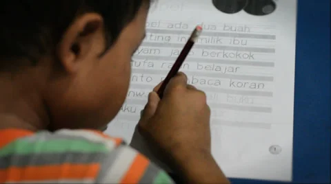 Indonesian boy learning to write Stock Footage 35538884