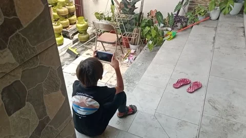 An Indonesian Boy Playing A Game Stock Footage 215320365