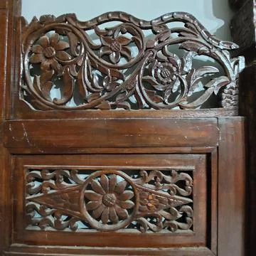 Indonesian Central Java ethnic wood carving which is commonly used for doors, wi Stock Photos