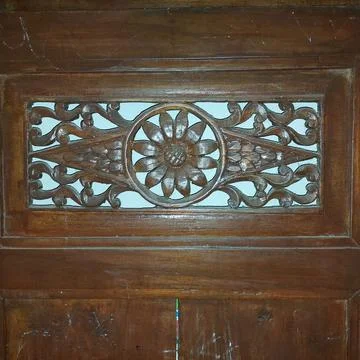 Indonesian Central Java ethnic wood carving which is commonly used for doors and Stock Photos