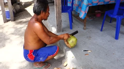 Indonesian cutting open coconut Stock Footage 45179553