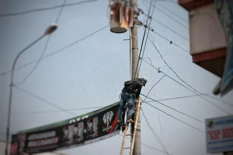An Indonesian electrical worker Stock Photos