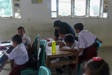 Indonesian elementary school students study in class. Stock Photos