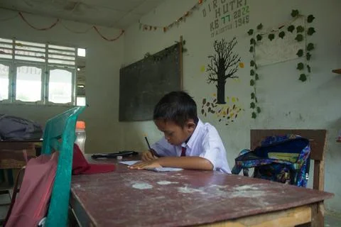 Indonesian elementary school students study in class. Stock Photos