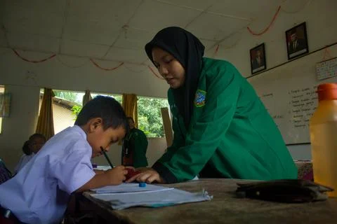 Indonesian elementary school students study in class. Stock Photos