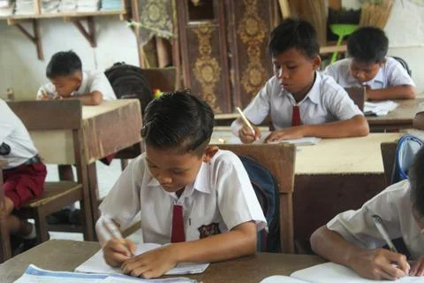 Indonesian elementary school students study in class. Stock Photos